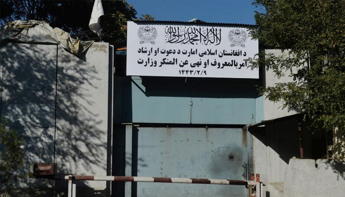 A sign of the Ministry for the Propagation of Virtue and the Prevention of Vice is seen at an entrance gate of a government building in Kabul. — AFP/file