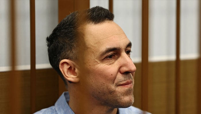 French researcher Laurent Vinatier, who is suspected of illegally collecting sensitive Russian military information, sits inside an enclosure for defendants before a court hearing in Moscow, Russia October 14, 2024. — Reuters