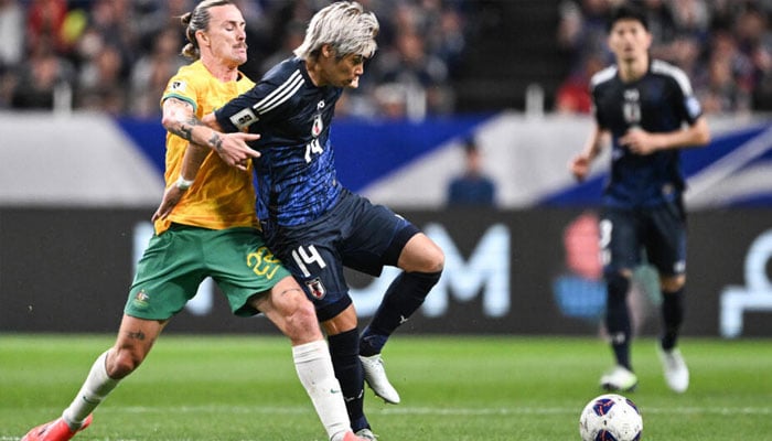 Australias Jackson Irvine (left) and Japans Junya Ito compete for the ball. — AFP/file