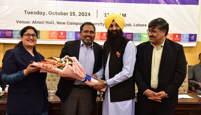 Punjab Minister for Human Rights and Minority Affairs Sardar Ramesh Singh Arora (2nd right) receives a flower bouquet from faculty members during a seminar on ‘Sustainable Social Practices: Combating Climate Change’ at Al Raazi Hall on October 15, 2024. — Facebook/University of the Punjab