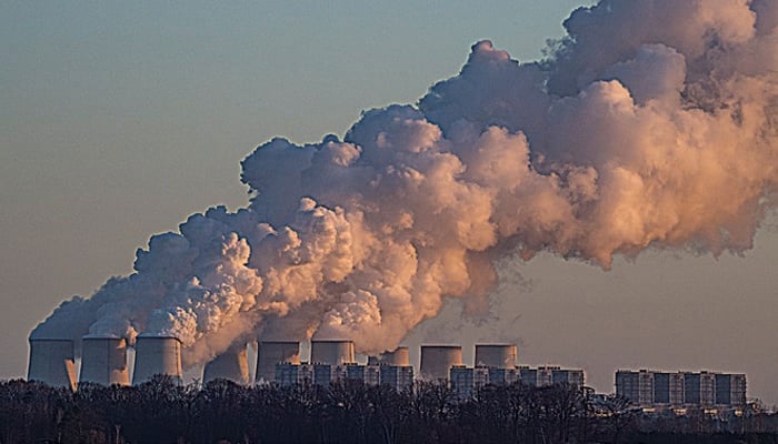 This image shows smoke coming out into the environment from a power plant. — AFP/File