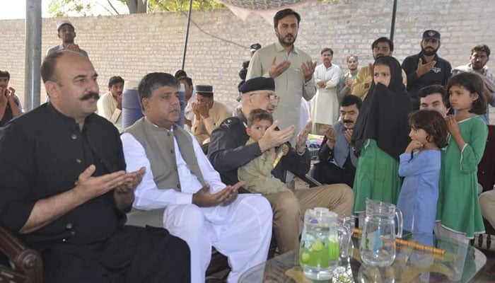 (From left to right) Minister for Public Health Engineering, Pakhtun Yar Khan, Chief Secretary Nadeem Aslam Chaudhry, and Inspector General of Police Akhtar Hayat Khan offer prayer for martyred cop, Muhammad Siraj at his residence on October 15, 2024. — Facebook/Pakhtoon Yar Khan