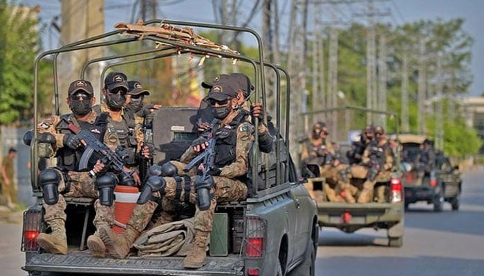 Pakistan army commandos depart in their vehicles on September 13, 2021. — AFP