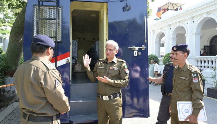 Inspector General of Police (IGP) Punjab Dr Usman Anwar (centre) inspects a prison police van on October 16, 2024. — Facebook/Punjab Police Pakistan