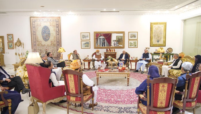 Leaders of the PML-N, PPP and JUI-F hold discussion over the 26th constitutional amendment at the Sharif familys residence in Jati Umrah, Lahore on Oct 16, 2024. — PID