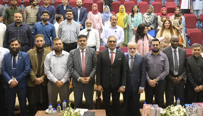 Participants pose for a group photo at an international conference on ‘Central Asia in the Changing World’ at the KU’s Jinnah Auditorium of the Dr. A.Q. Khan Institute of Biotechnology and Genetic Engineering on October 16, 2024. — Facebook/Karachi University