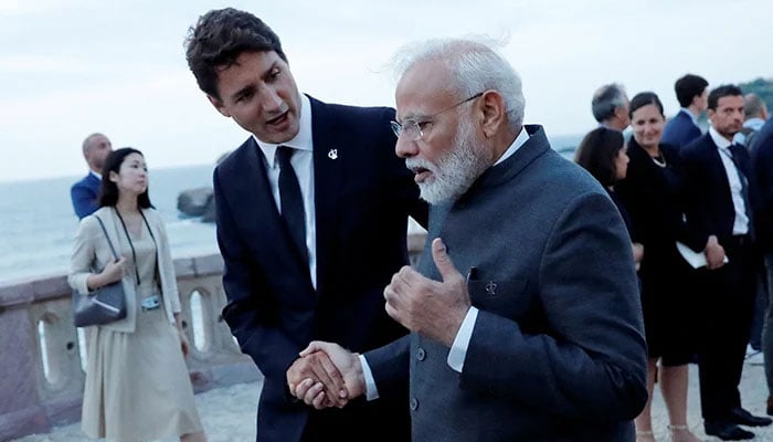 Canadas PM Justin Trudeau shakes hands with Indian PM Narendra Modi after a family photo with invited guests at the G7 summit in Biarritz, France, on August 25, 2019. — Reuters