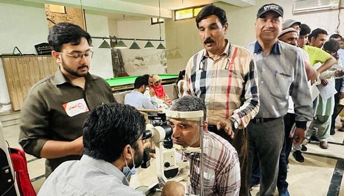 A representational image shows a doctor examining the eyes of patients on May 19, 2024. — Facebook/Al Ehsan Welfare Eye Hospital