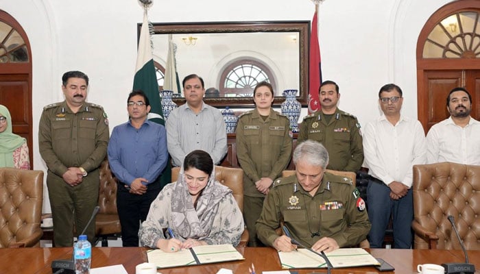 Chairperson Child Protection and Welfare Bureau Sara Ahmed (left) and IGP Punjab Dr Usman Anwar (right) sign an MOU in this image, released on October 17, 2024. — Facebook/Punjab Police Pakistan