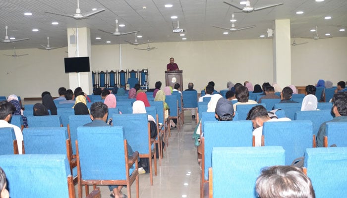 Participant speaks at the Punjab University Library Book Clubs book-launching ceremony on October 17, 2024. — Facebook/Punjab University Library