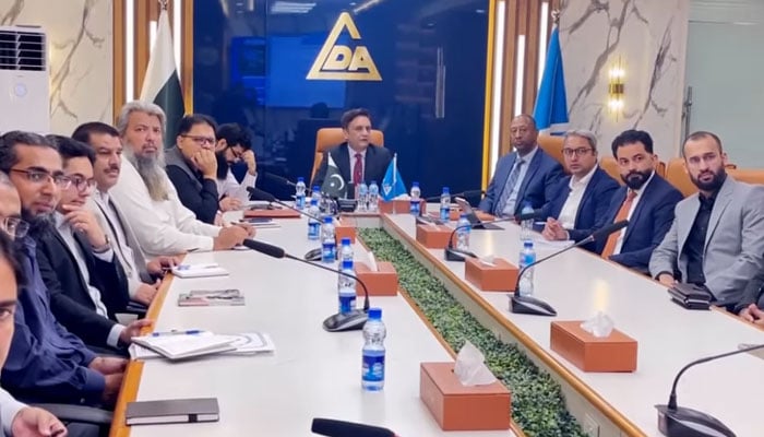 A seven-member delegation of Dubai Land Development (DLD) in a meeting with DG LDA Tahir Farooq (centre) during their visit to the LDA office on October 17, 2024. — Screengrab via Facebook/Lahore Development Authority