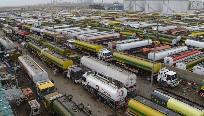 An overview shows tankers parked outside a local oil refinery in Pakistans port city of Karachi. — AFP/File