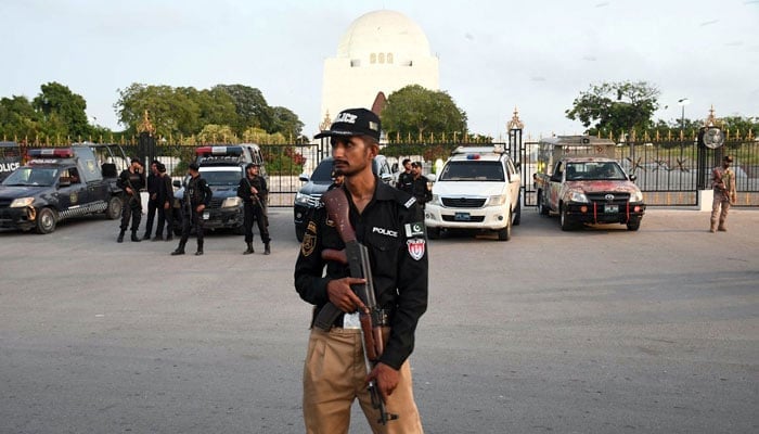 Representational image shows a policeman standing guard outside Mazar-e-Quaid in Karachi on May 9, 2024. — Online