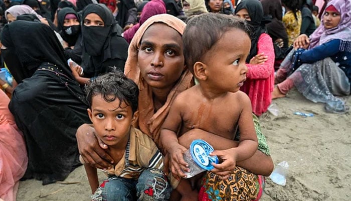 Newly-arrived Rohingya refugees wait to be transferred to a shelter in Batee beach, Aceh province, Indonesia, on 15 November, 2023. — AFP/file