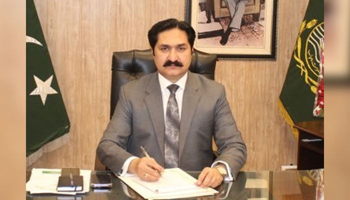 Gujrat Deputy Commissioner Safdar Hussain sits at his office in this image. — X/@DC_Gujrat/File