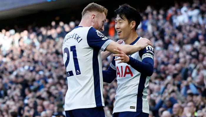 Tottenham Hotspur’s South Korean striker #07 Son Heung-Min (R) celebrates with Tottenham Hotspur’s Swedish midfielder #21 Dejan Kulusevski (L) after scoring their fourth goal during the English Premier League football match between Tottenham Hotspur and West Ham United at the Tottenham Hotspur Stadium in London, on October 19, 2024. — AFP