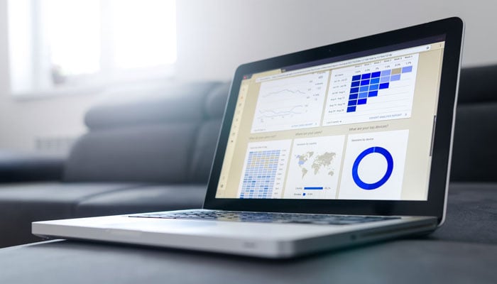 The representational image shows an analytics page open at a laptop. — Unsplash/File