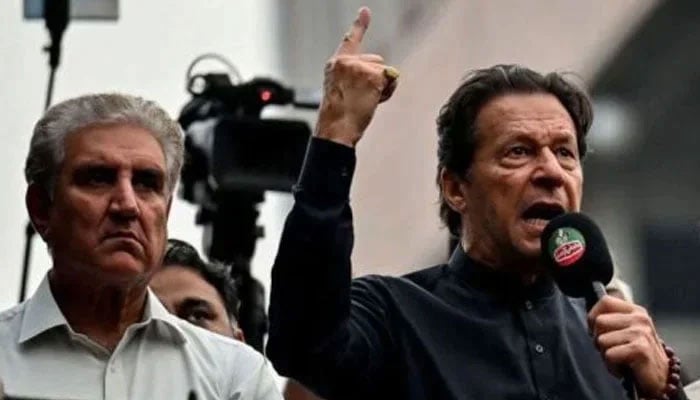 PTI founder Imran Khan (left) pictured alongside senior party leader Shah Mahmood Qureshi during a public gathering. — AFP/File