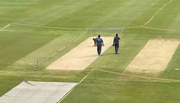 A cricket pitch is being inspected by players. — Arfa Feroz Zake/file