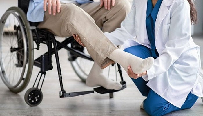 This representational image shows a female doctor treating a paralysis patient. — imchospital.com.pk website/file