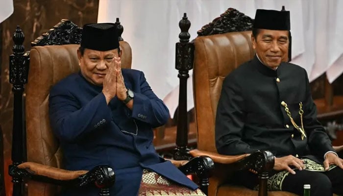 Indonesias new President Prabowo Subianto (left) and his predecessor Joko Widodo (right) sit during the presidential inauguration ceremony at the Parliament building in Jakarta on October 20, 2024. — AFP