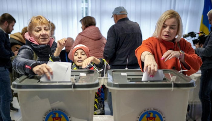 People casting votes in the Moldovian elections. — AFP/file