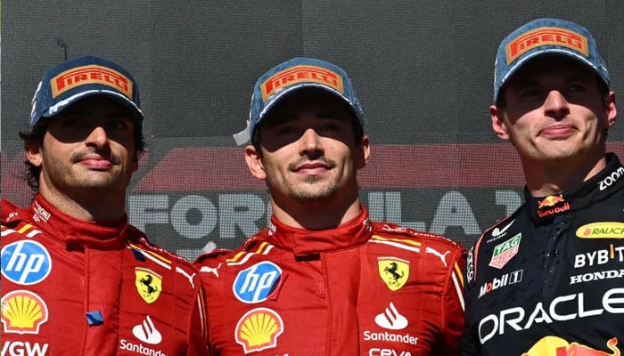 Ferraris drivers Charles Leclerc (centre),Carlos Sainz Jr and Max Verstappen (right) posing for a photo after race.— AFP/file