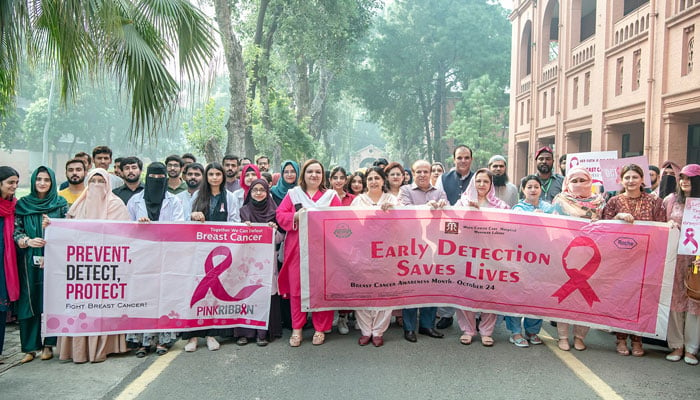 Participants hold banners at an awareness walk on Breast Cancer with the theme of ‘Together we can defeat breast cancer’ in UVAS on October 21, 2024. — Facebook@UVAS.Pakistan/