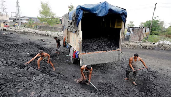 Labourers load coal onto a supply truck on April 6, 2017.— Reuters/file