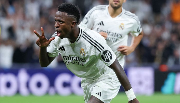 Real Madrid´s Brazilian forward Vinicius Junior celebrates scoring a hat-trick and his team´s fifth goal during the UEFA Champions League, league phase day 3 football match between Real Madrid CF and Borussia Dortmund at the Santiago Bernabeu stadium in Madrid on October 22, 2024. — AFP