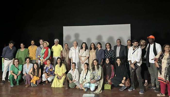 Karachi Biennale team pose for a group photo after a press conference on October 23, 2024. — Facebook@KarachiBiennaleTrust