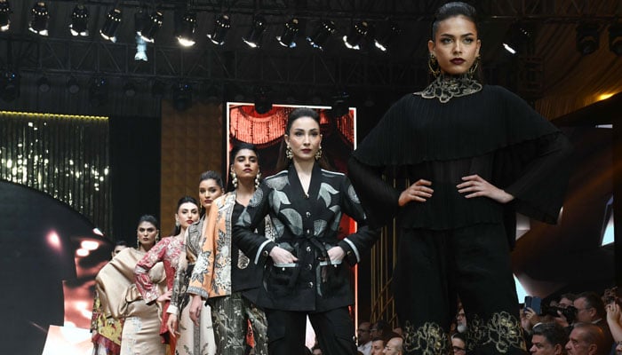 Pakistani models display creations by designers at Expo Pakistan Fashion Show in Karachi, on October 23, 2024. — Online