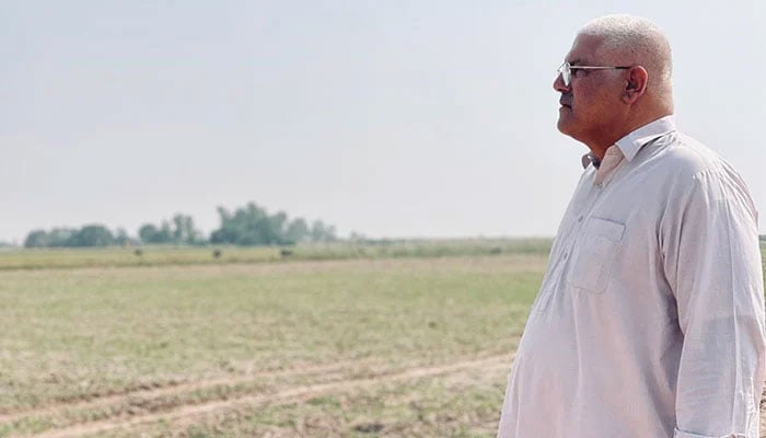 Sajjad Warraich at his farm near the Ravi River. — Author.