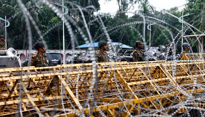 Security personnel stand guard in front of the Bangabhaban, the residence and workplace of President Mohammed Shahabuddin after protesters demanded the resignation of Shahabuddin in Dhaka, Bangladesh, October 23, 2024. — Reuters.