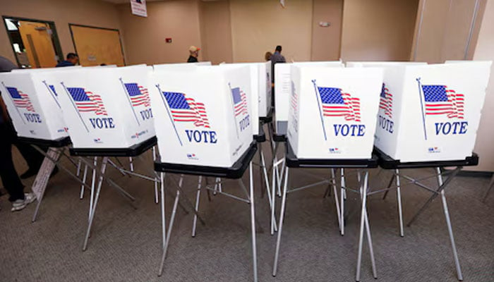 Poll workers with the Hillsborough County Supervisor of Elections Office, work to setup early voting equipment at the Seffner-Mango Branch Library in Seffner, Florida, US, August 2, 2024. — Reuters