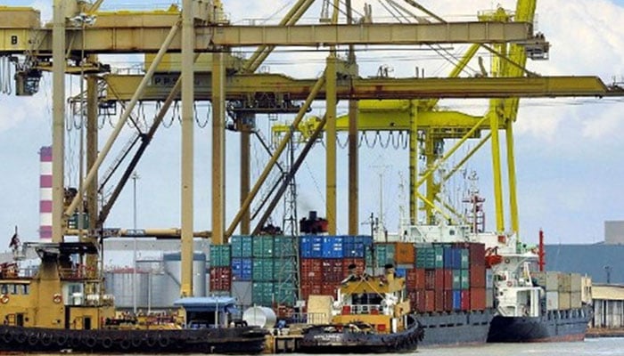 In this picture, containers, ship and small boats are seen at KPT port. — AFP/File