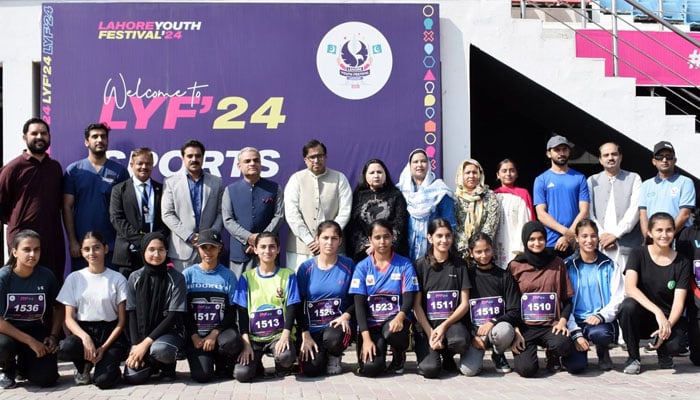 The image shows a group photo of athletes taking part in 100-metre girls’ trials for the Lahore Youth Festival at Fortress Stadium on Oct 25, 2024. — Facebook/Directorate General Sports & Youth Affairs, Punjab