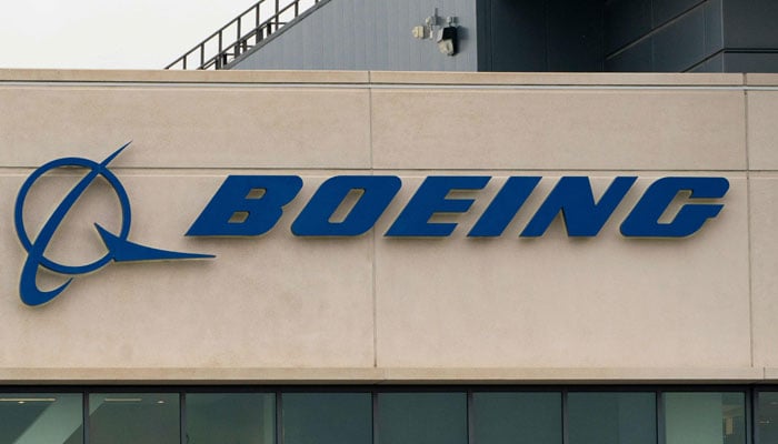 A Boeing sign is seen on the exterior of a building in Seattle, Washington on October 24, 2024. — AFP