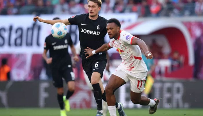 Lois Openda (right) scored in Leipzigs 3-1 home win over Freiburg on Oct 26, 2024. — AFP