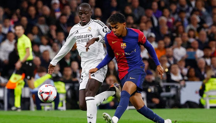 FC Barcelonas footballer Lamine Yamal in action with Real Madrids Ferland Mendy on October 26, 2024. — Reuters