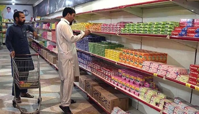 People can be seen shopping for commodities in this photo. — APP/File