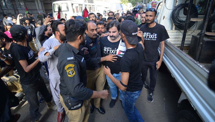 Police arrest Tehreek-e-Insaf (PTI) Leader, Alamgir Khan during the protest demonstration  at Karachi Press Club on October 27, 2024. — PPI