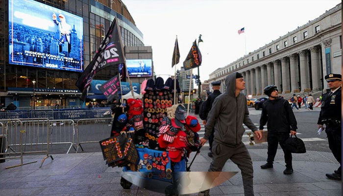 A vendor sells Trump merchandise outside Madison Square Garden ahead of a rally for Republican presidential nominee and former US President Donald Trump in New York on October 27. — Reuters