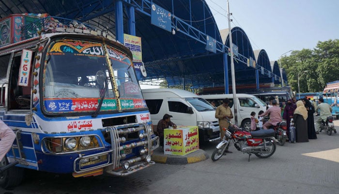 Representational image shows passengers gathering for boarding at a bus stand in Gujranwala on September 4, 2024. — PPI