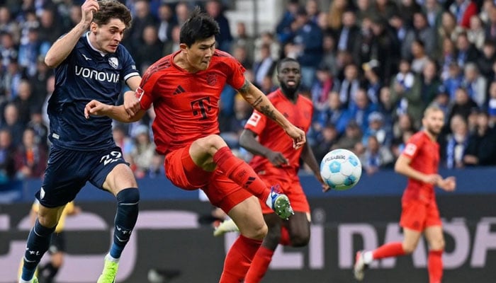 Bochum’s German forward Moritz Broschinski (left) and Bayern Munich’s South Korean defender Kim Min-Jae vie for the ball during the German first division Bundesliga football match between VfL Bochum and FC Bayern Munich in Bochum, western Germany, on October 27, 2024.— AFP