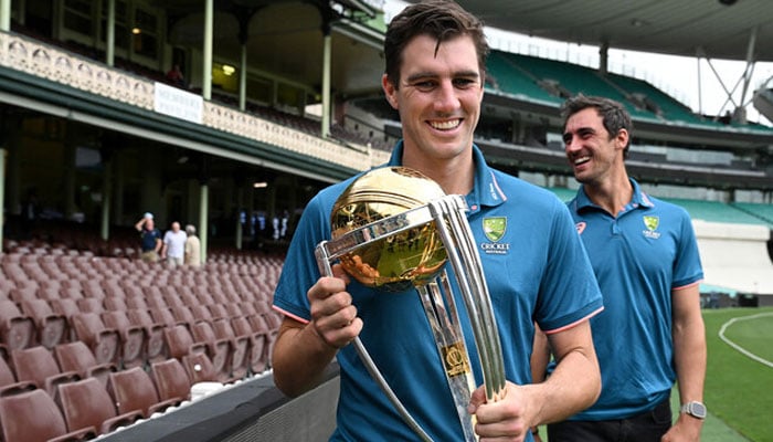 Australian cricketers Mitchell Starc (left) and Pat Cummins pose with the ICC Men’s Cricket World Cup 2023 Trophy during a media opportunity at the Sydney Cricket Ground on November 28, 2023. —AFP