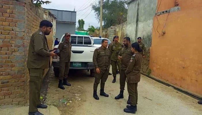 This image shows Rawalpindi Police officials interacting with each other on November 30, 2023. — Facebook@RawalpindiPolice