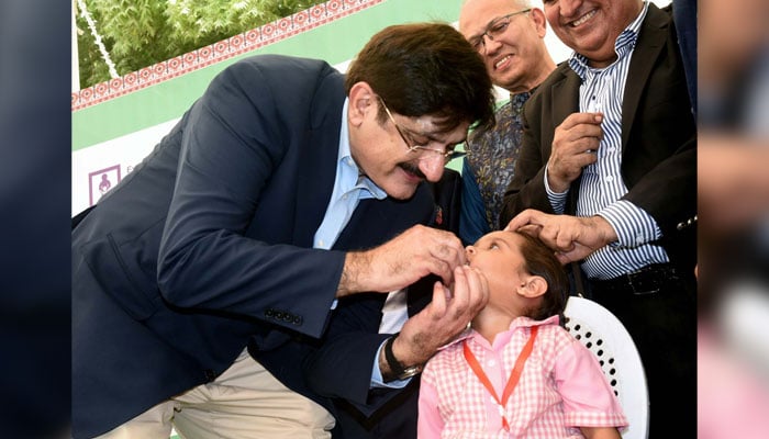 Sindh Chief Minister, Syed Murad Ali Shah administers polio drops to a child during the launching ceremony a week long the Polio Eradication Campaign, on his visit to SMB Fatima Jinnah School at Garden East in Karachi on October 28, 2024. — PPI