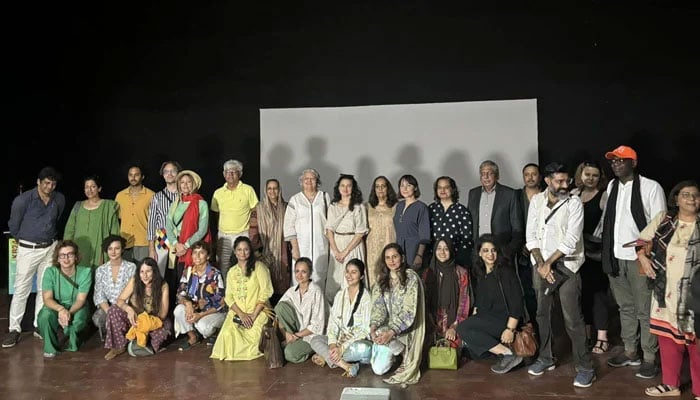 The representational image shows the Karachi Biennale team posing for a group photo after a press conference on October 23, 2024. — Facebook@KarachiBiennaleTrust