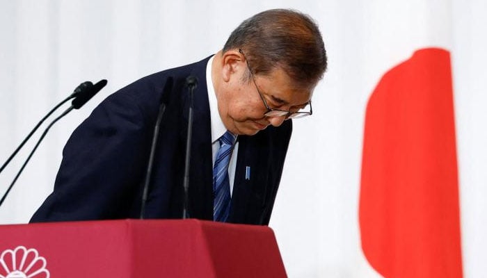 Japanese Prime Minister Shigeru Ishiba bows to Liberal Democratic Party lawmakers onstage after a news conference at the partys headquarters in Tokyo today on October 29,2024. — AFP